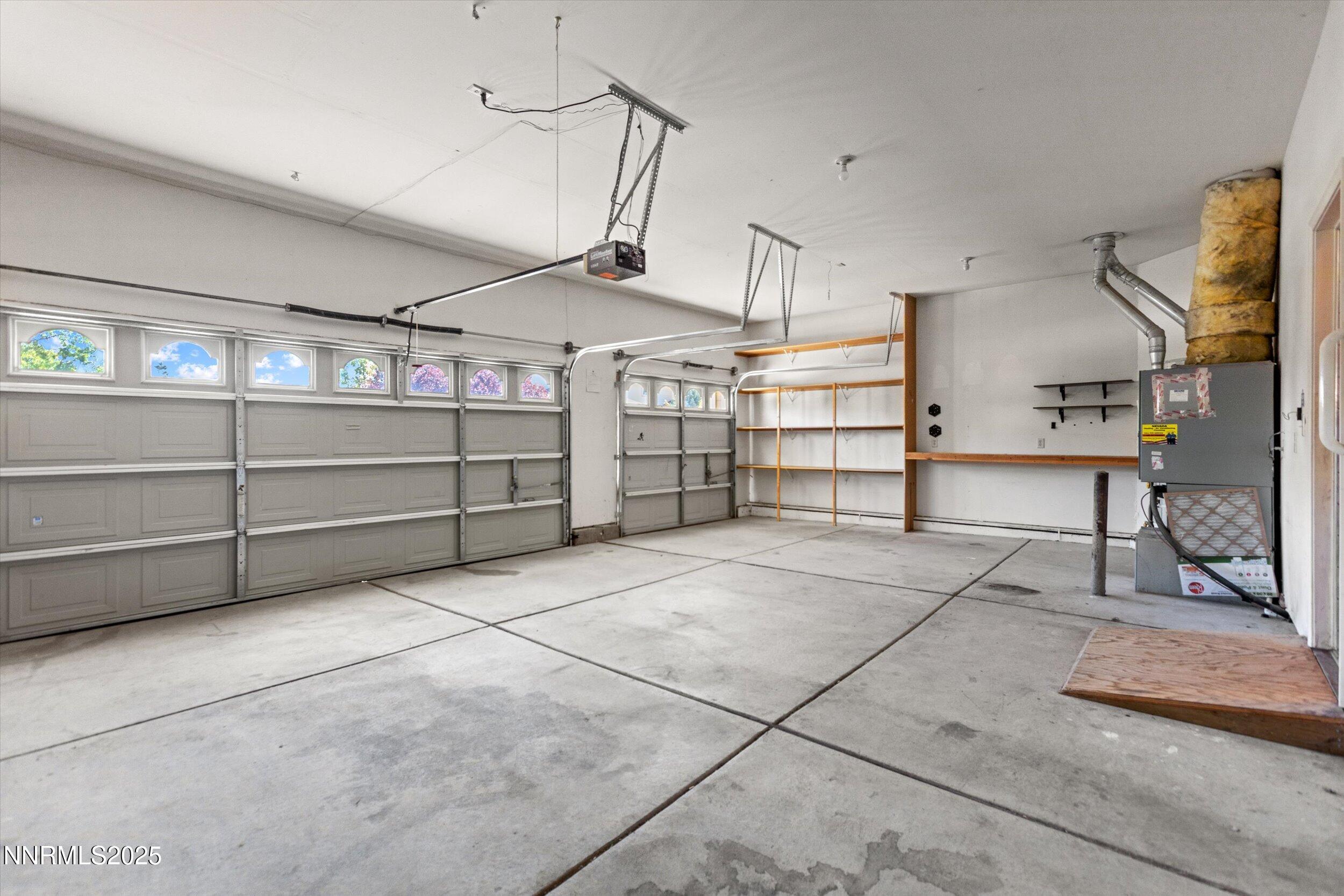 2365 Red Maple Court Reno, NV 89523 - Photo 32 of 34 a view of a garage with wooden table and chairs