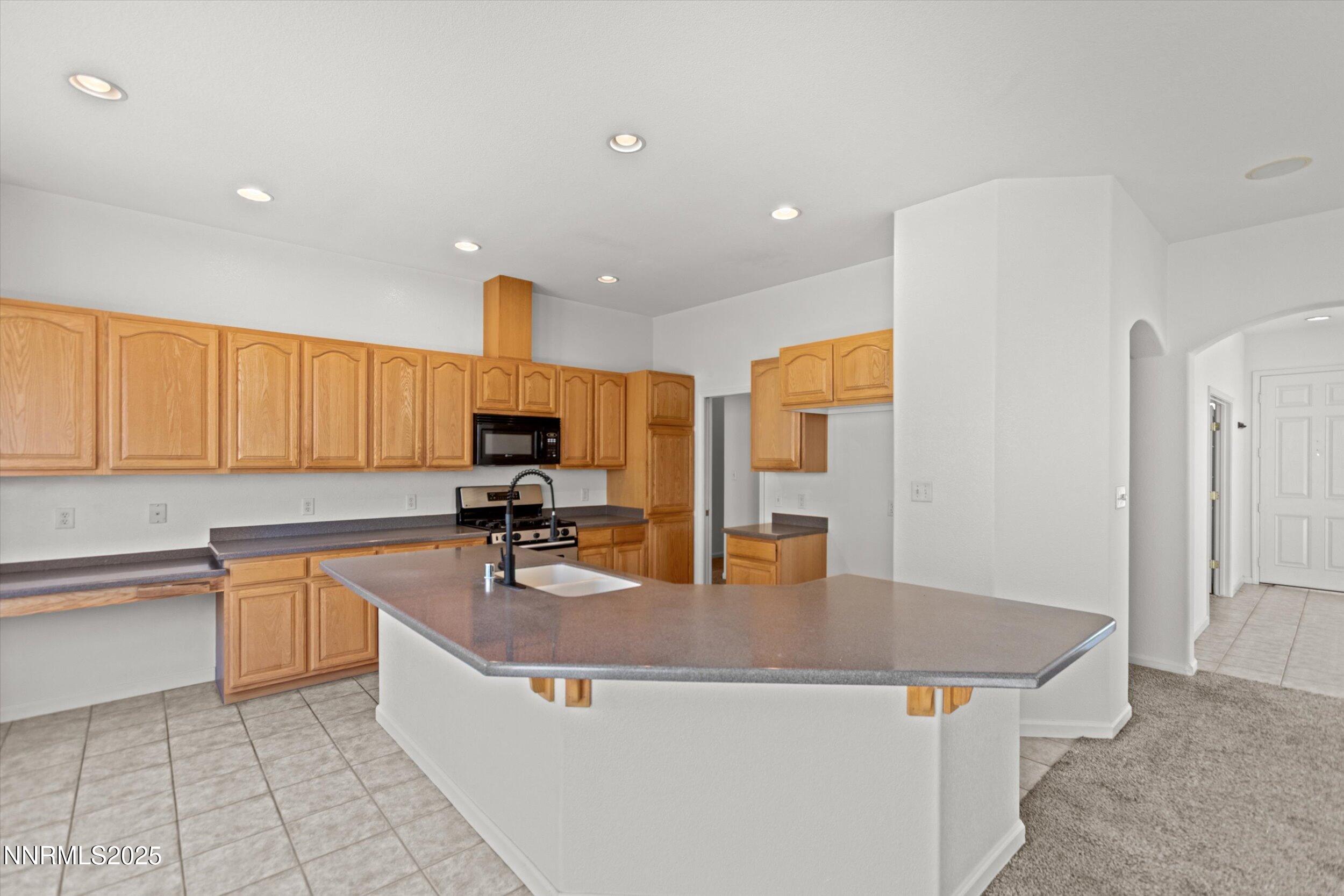 2365 Red Maple Court Reno, NV 89523 - Photo 10 of 34 a kitchen with stainless steel appliances granite countertop a sink counter space and cabinets