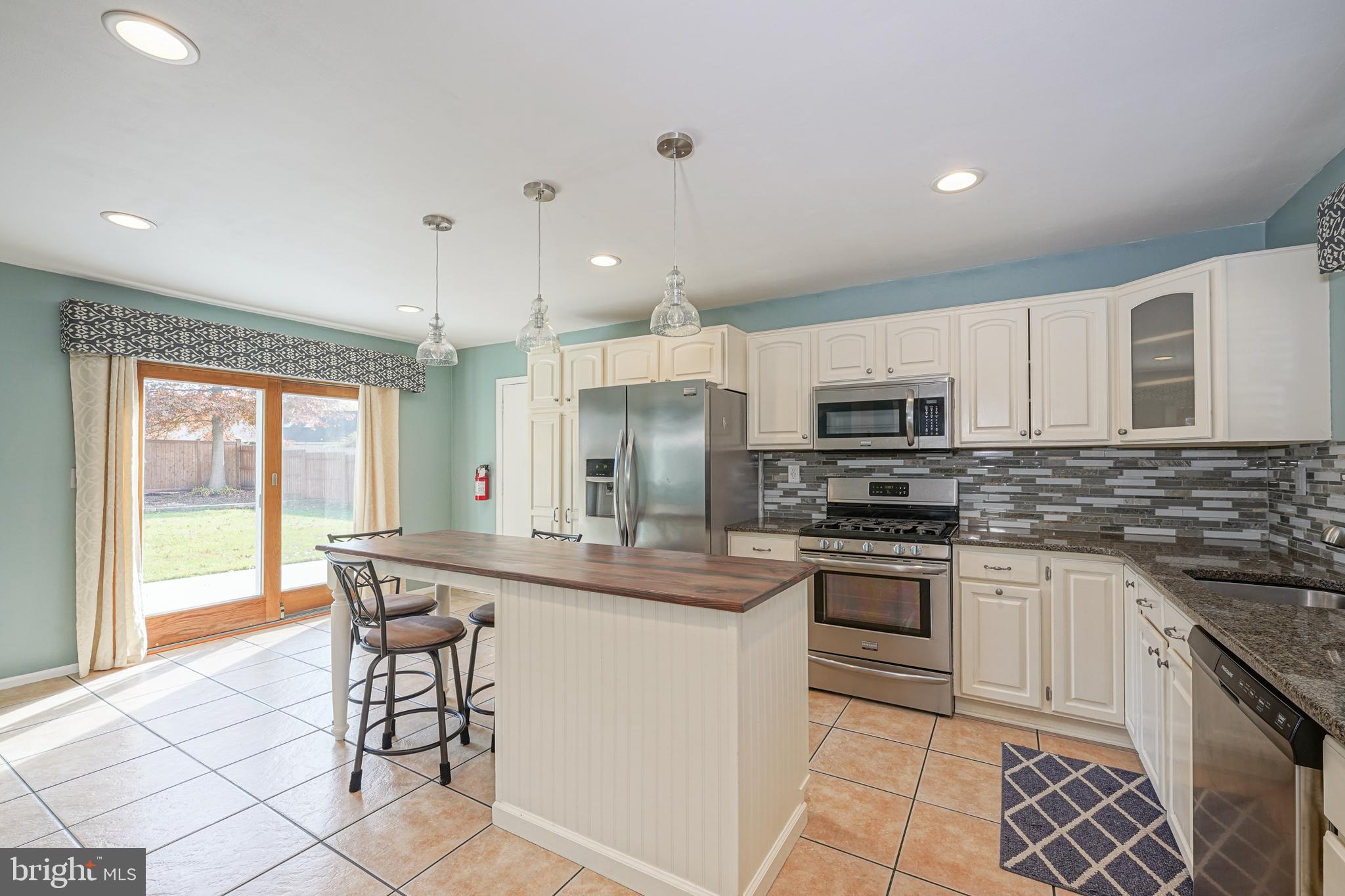 10 Gladstone Road Marlton, NJ 08053 - Photo 12 of 28 a kitchen with stainless steel appliances granite countertop a stove a sink a microwave and a refrigerator