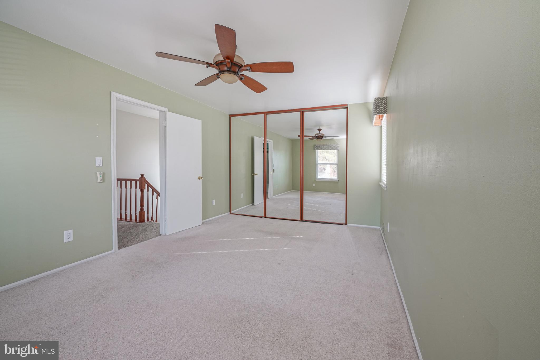 10 Gladstone Road Marlton, NJ 08053 - Photo 17 of 28 a view of a hallway with a chandelier fan and windows
