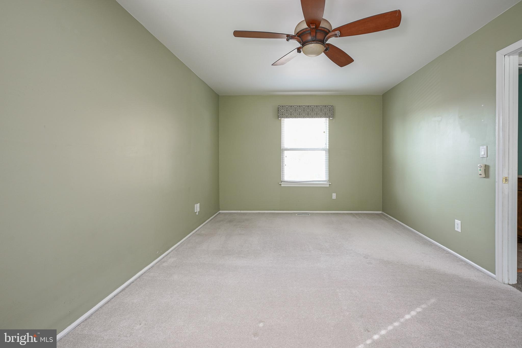 10 Gladstone Road Marlton, NJ 08053 - Photo 18 of 28 an empty room with windows and fan
