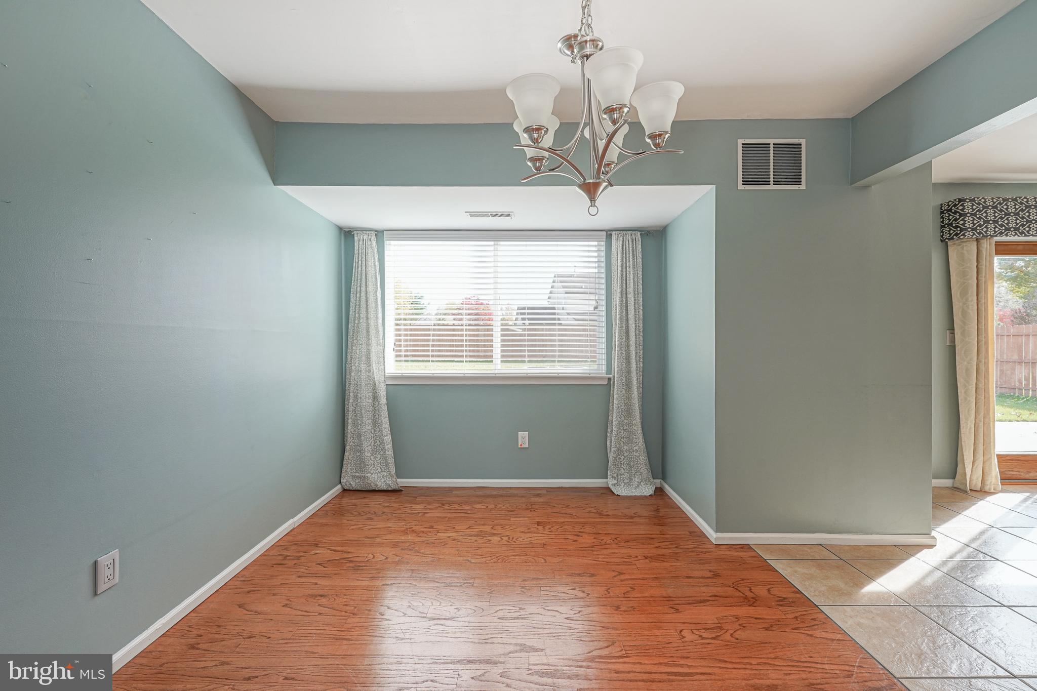 10 Gladstone Road Marlton, NJ 08053 - Photo 7 of 28 a view of a livingroom with a chandelier fan and windows
