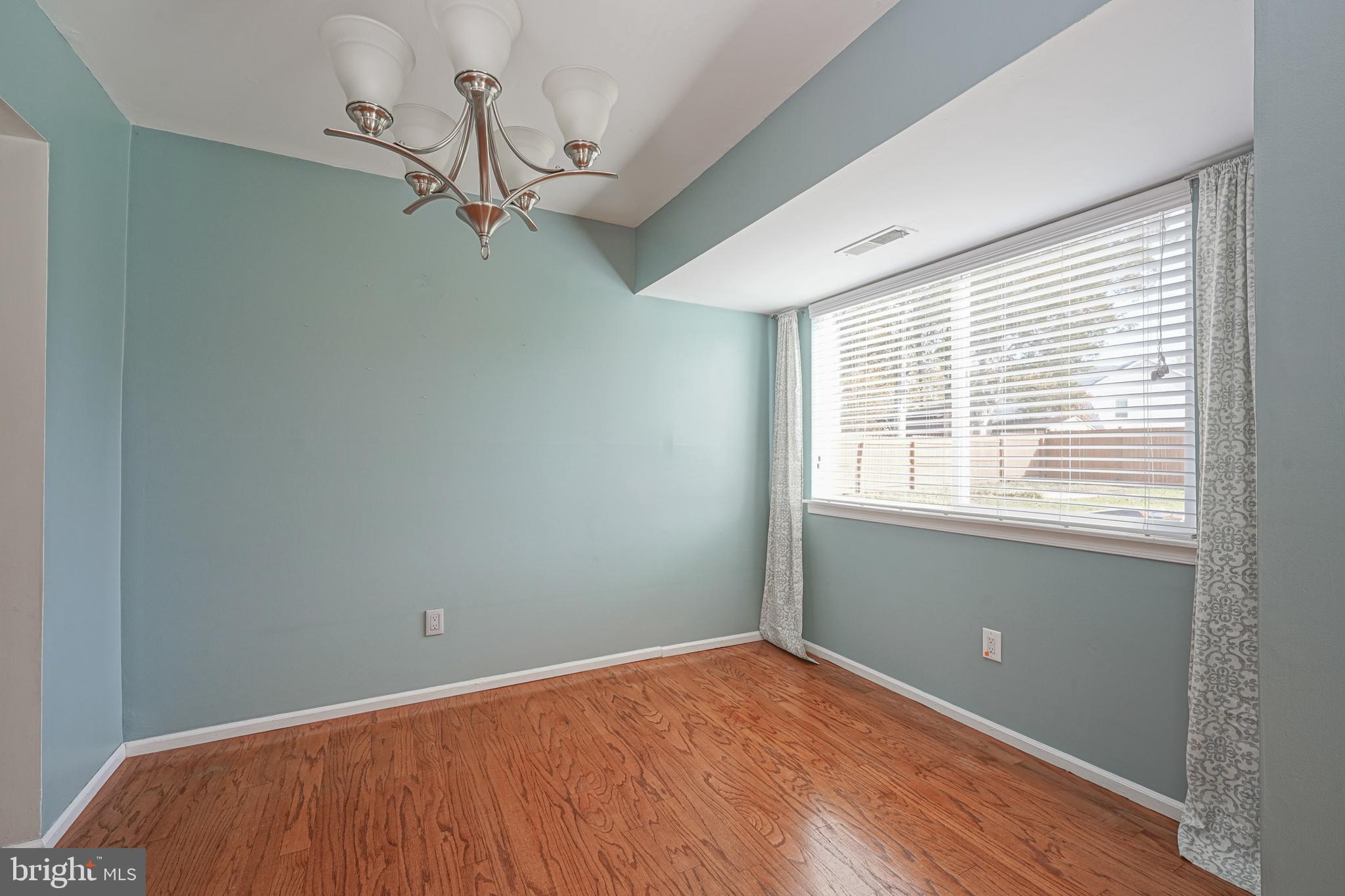 10 Gladstone Road Marlton, NJ 08053 - Photo 8 of 28 a view of empty room with wooden floor and fan