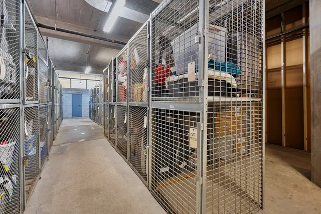 a room with gym equipment and a table