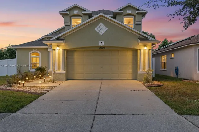 a front view of a house with yard