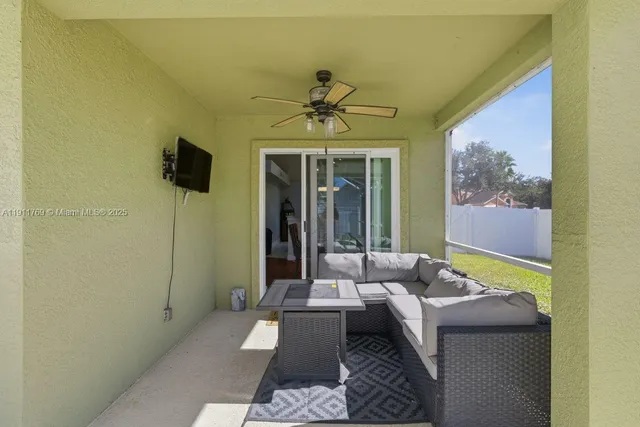 a living room with furniture and a window
