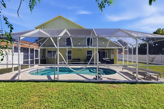 a view of a house with swimming pool