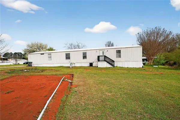 a view of a swimming pool with an outdoor space and seating area