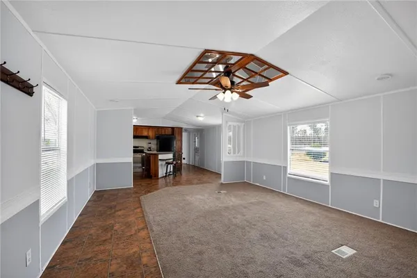 a view of a livingroom with window and furniture