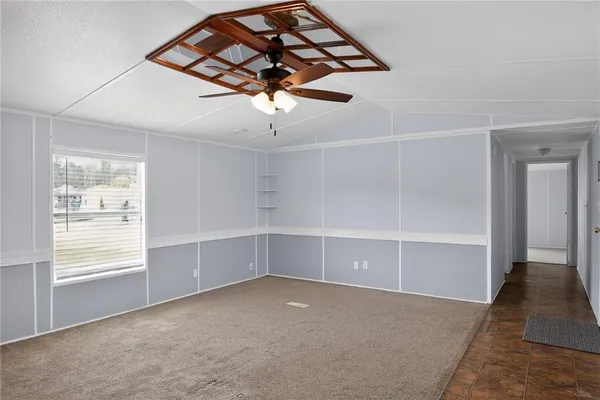 an empty room with a empty space and windows