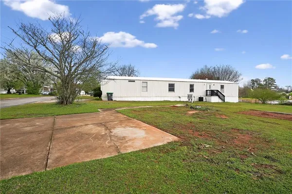 a view of a house with a big yard