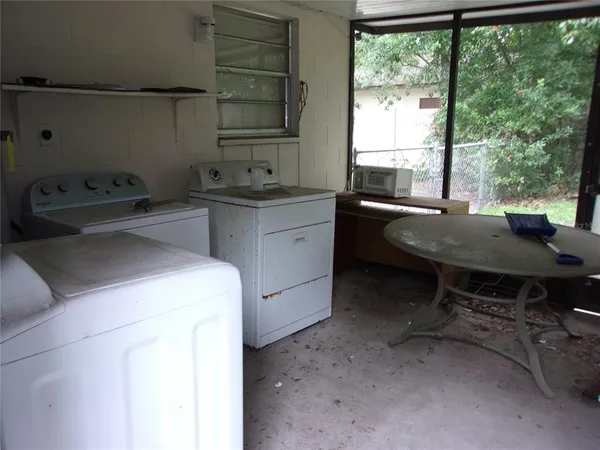 a room with a sink and a large window