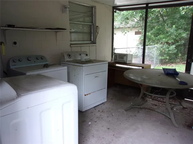 a room with a sink and a large window