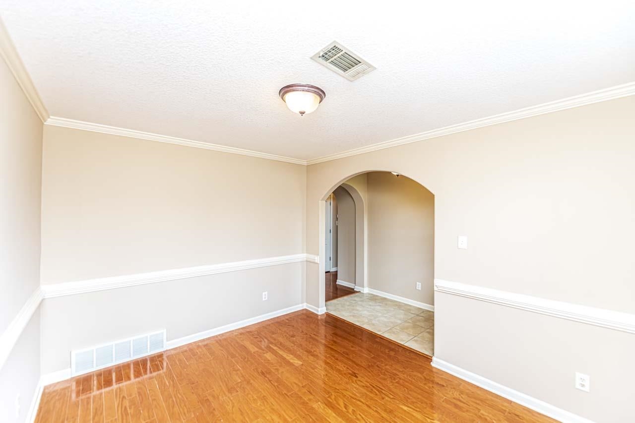 260 Terry Road Oakland, TN 38068 - Photo 17 of 33 Dining room with light tile patterned flooring, a textured ceiling, and ornamental molding