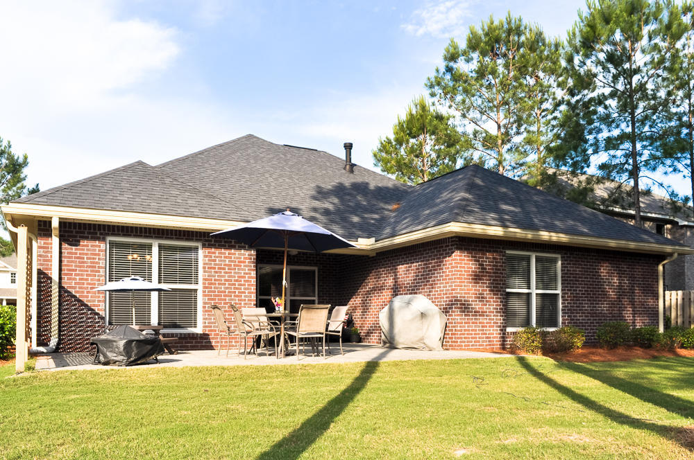456 Windchime Way Freeport, FL 32439 - Photo 2 of 29 a house view with swimming pool and glass windows