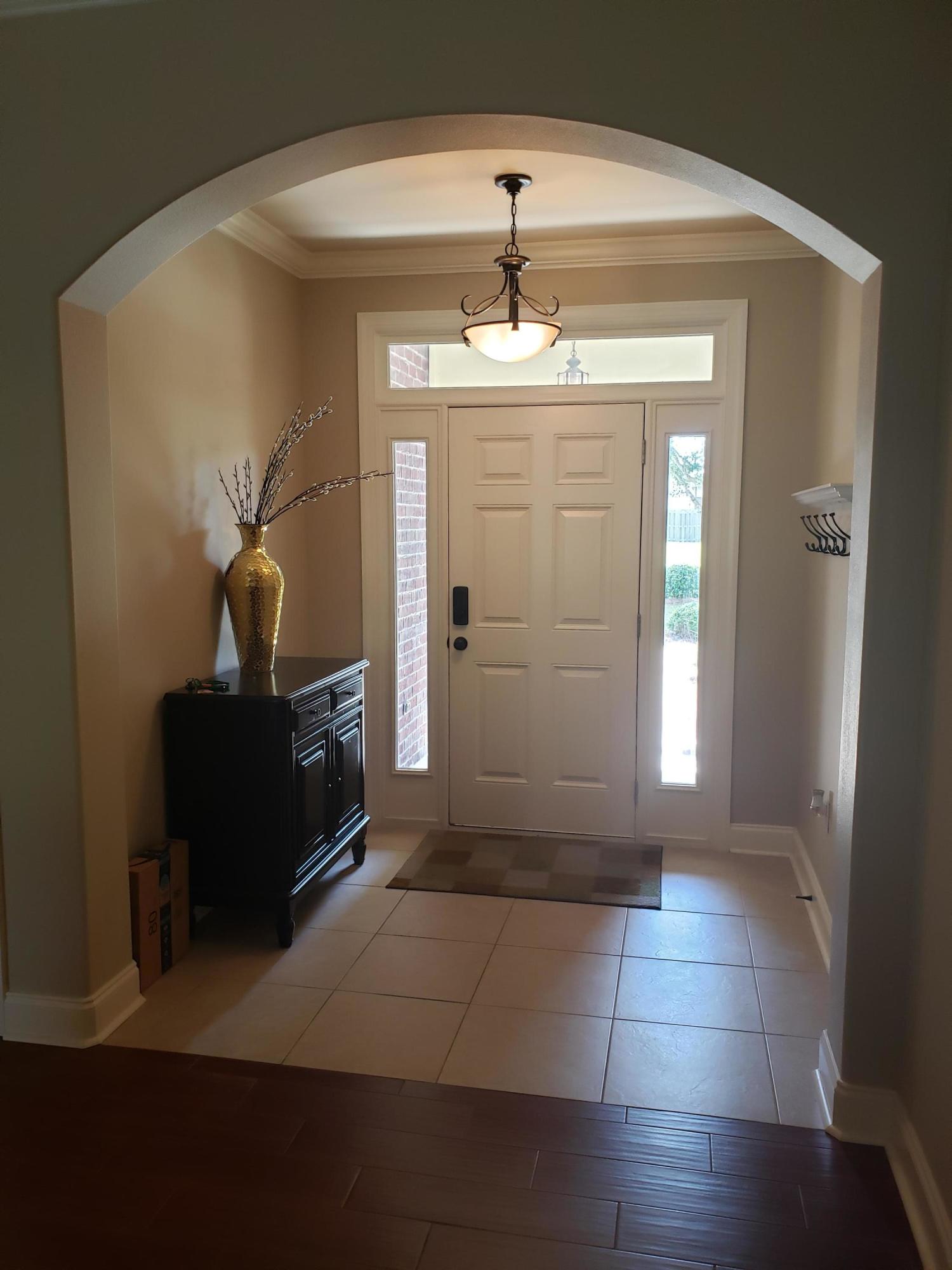 456 Windchime Way Freeport, FL 32439 - Photo 3 of 29 a view of a windows and a chandelier in a room