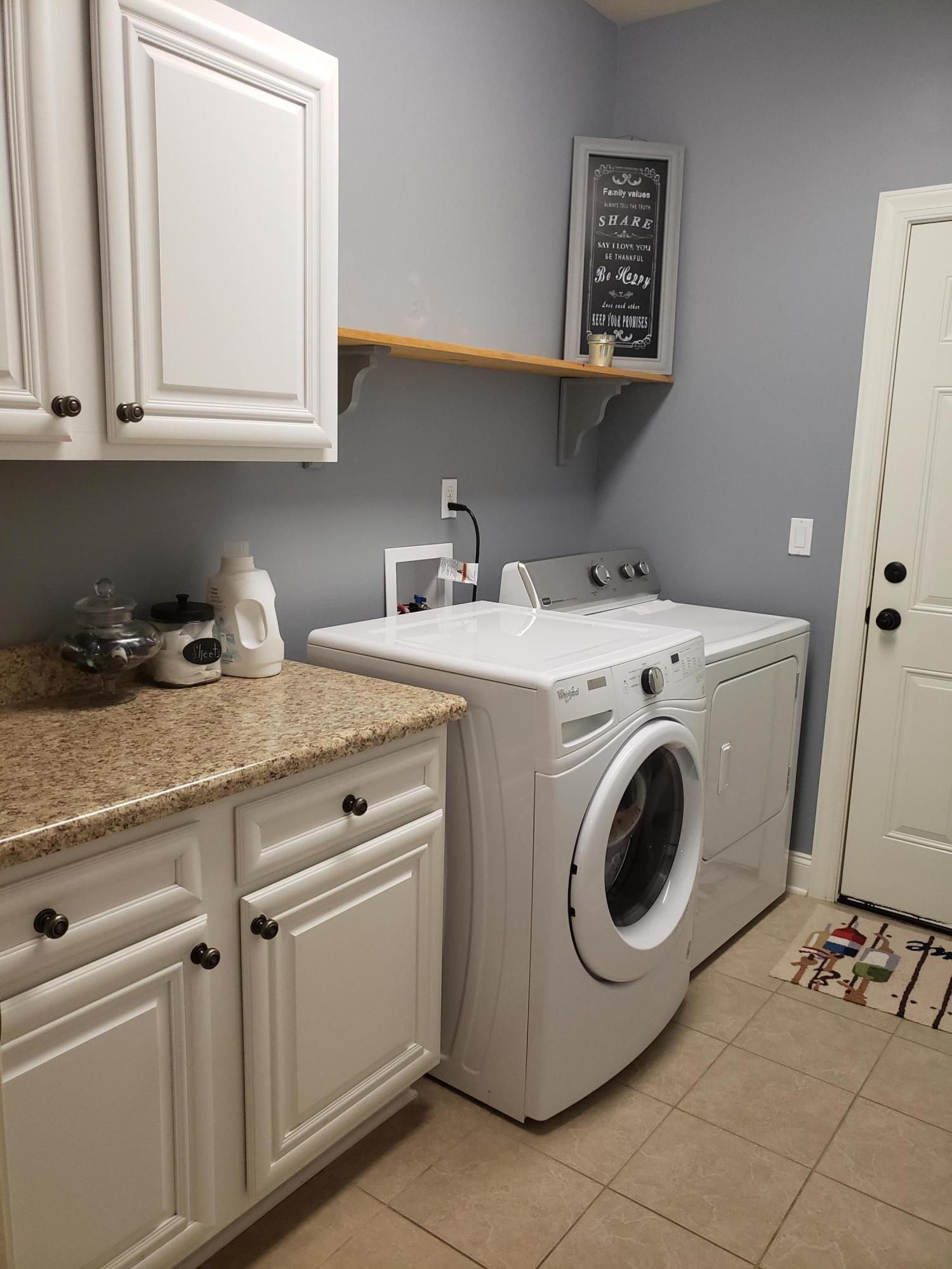 456 Windchime Way Freeport, FL 32439 - Photo 8 of 29 a utility room with sink dryer and washer
