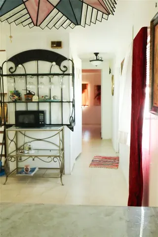 a white toilet sitting next to a white sink