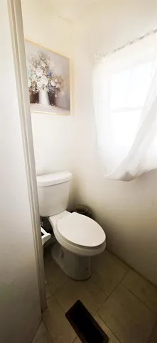 a bathroom with a sink toilet and mirror