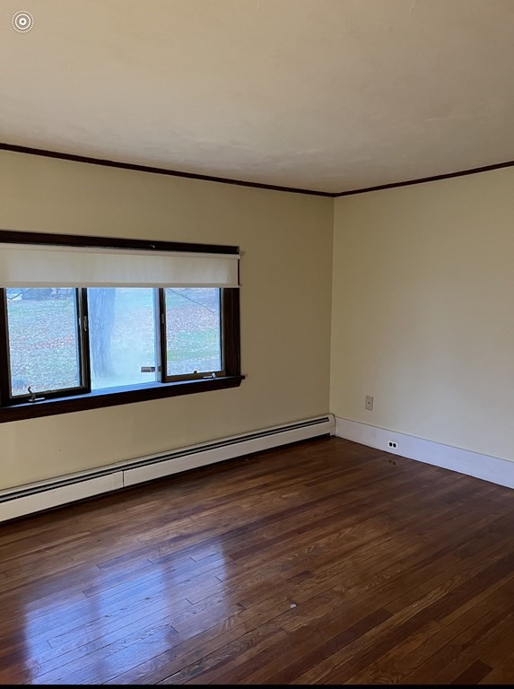 37 Harding Street North Chelmsford, MA 01863 - Photo 4 of 10 a view of an empty room with wooden floor and a window