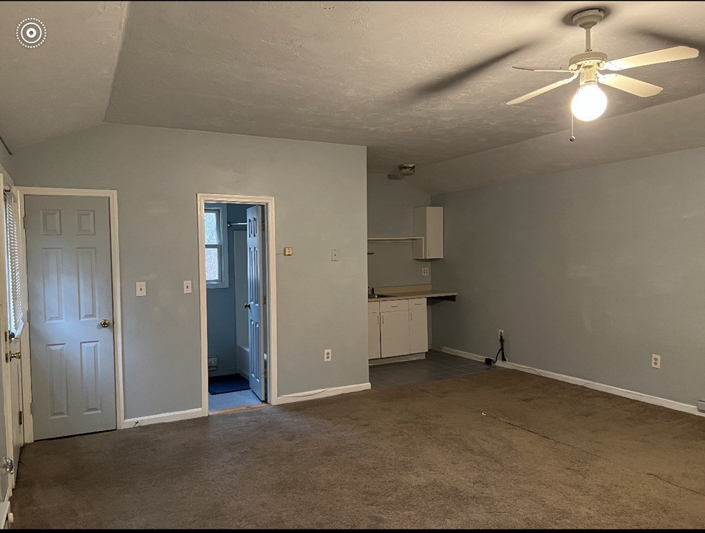37 Harding Street North Chelmsford, MA 01863 - Photo 10 of 10 an empty room with a ceiling fan and bathroom view