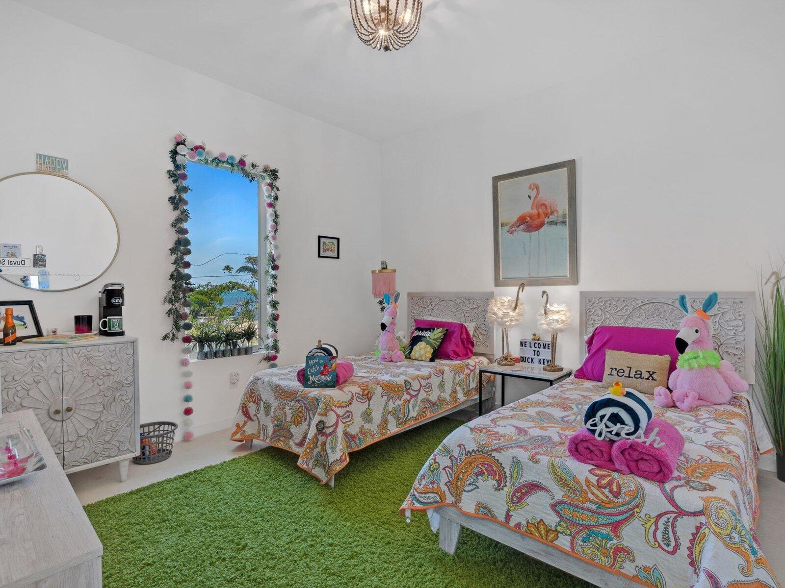 317 East Seaview Circle Marathon, FL 33050 - Photo 16 of 52 a bedroom with two beds and a potted plant