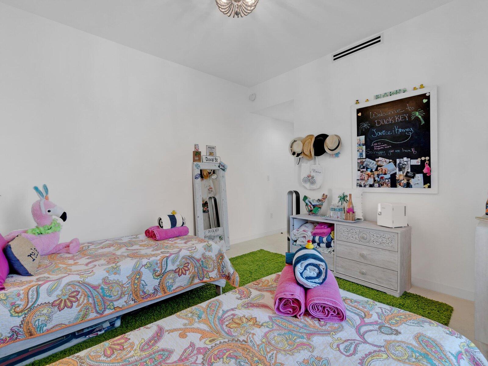 317 East Seaview Circle Marathon, FL 33050 - Photo 17 of 52 a bedroom with toys and a bed