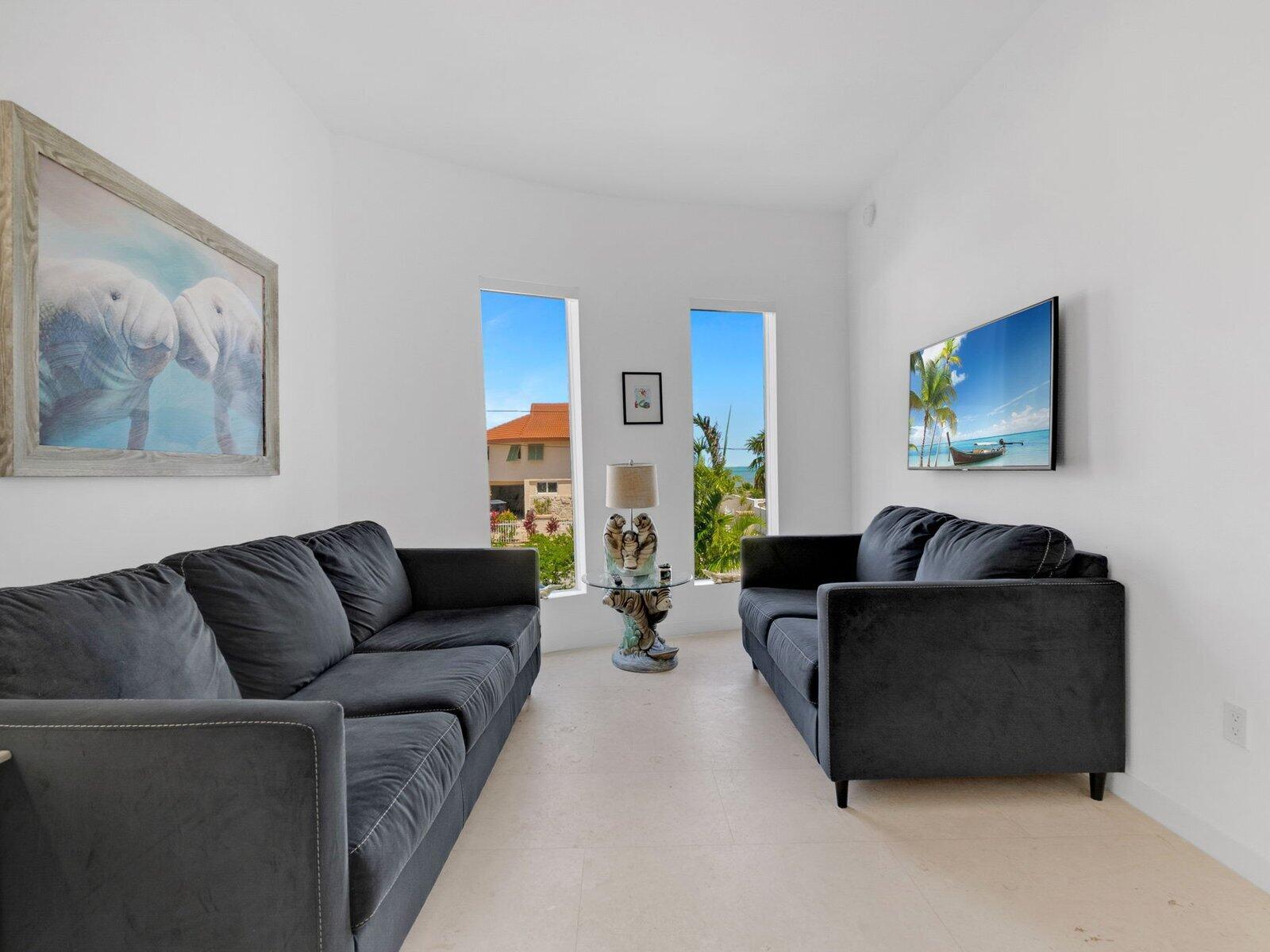 317 East Seaview Circle Marathon, FL 33050 - Photo 18 of 52 a living room with furniture and a couch