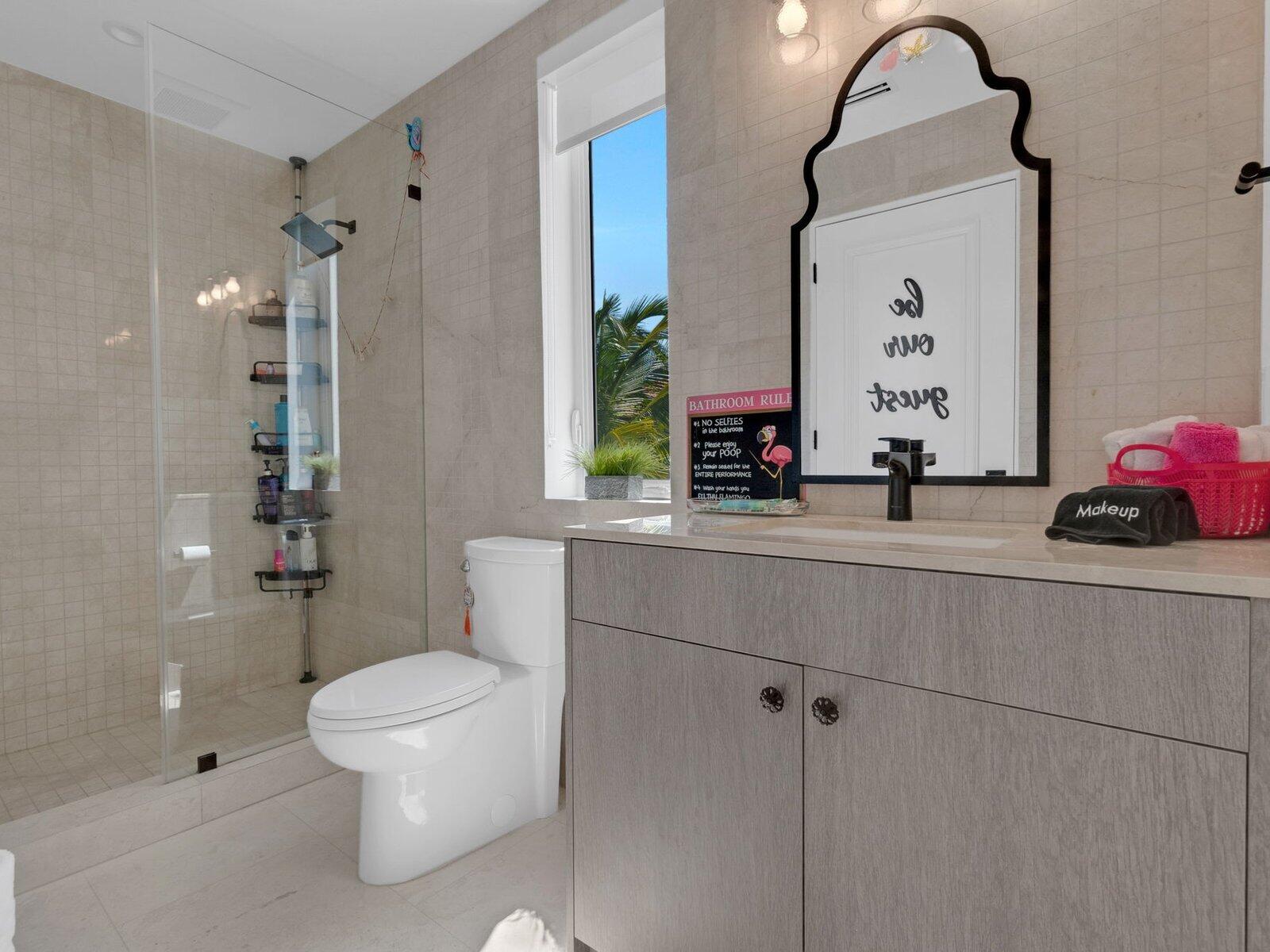 317 East Seaview Circle Marathon, FL 33050 - Photo 20 of 52 a bathroom with a toilet sink and shower