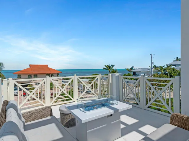 a view of balcony with furniture and outdoor kitchen