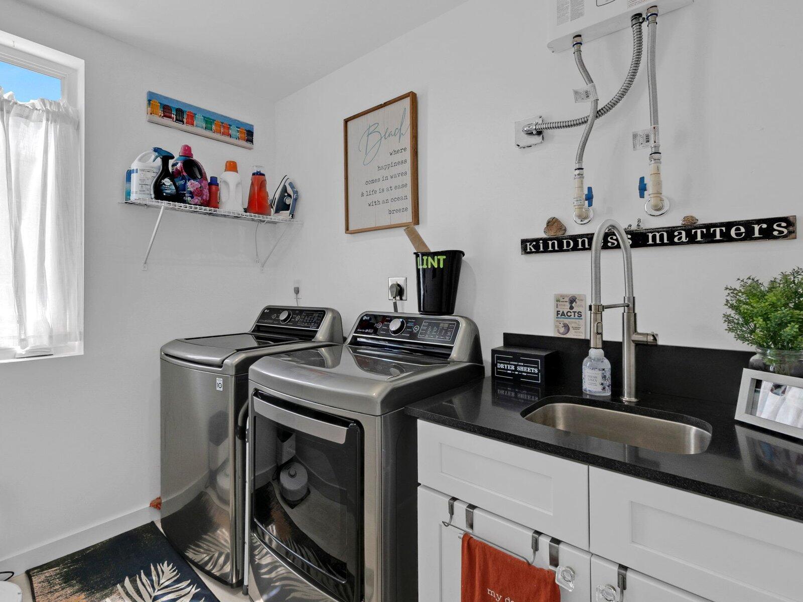 317 East Seaview Circle Marathon, FL 33050 - Photo 21 of 52 a kitchen with stainless steel appliances granite countertop a sink stove and cabinets