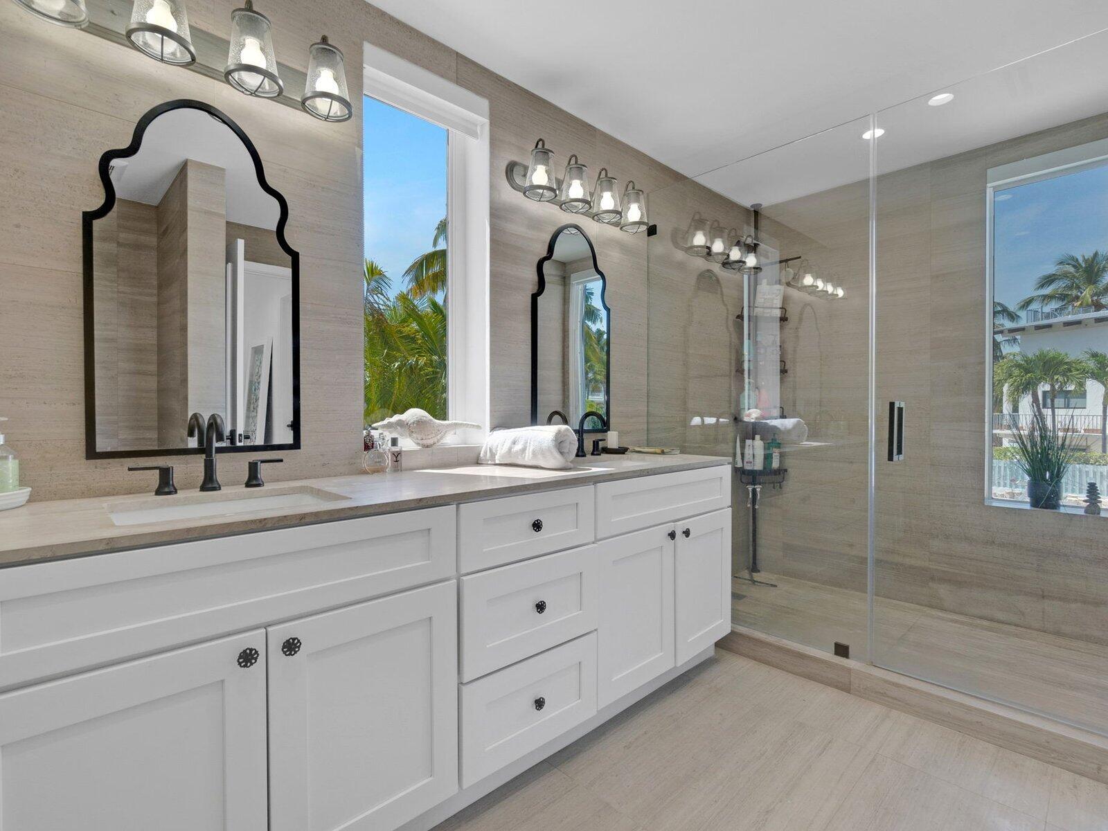 317 East Seaview Circle Marathon, FL 33050 - Photo 23 of 52 a bathroom with double vanity sinks and a mirror