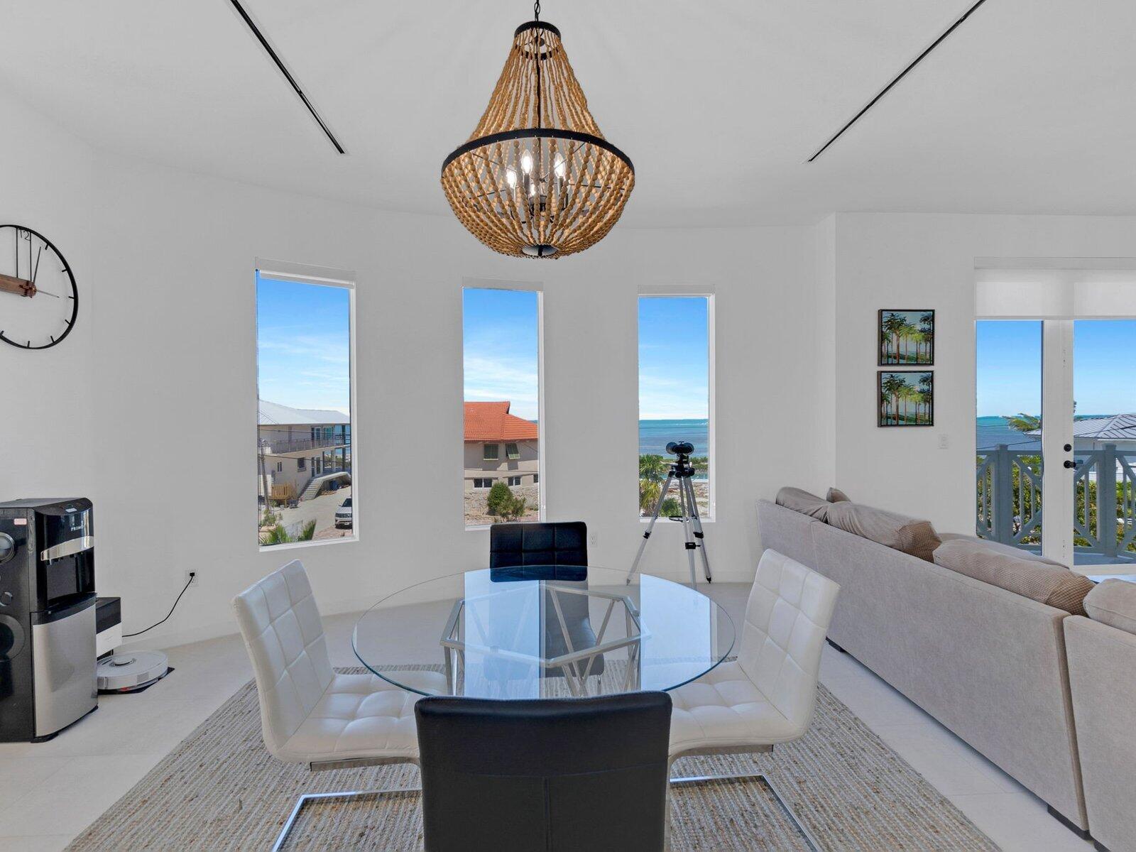 317 East Seaview Circle Marathon, FL 33050 - Photo 28 of 52 a view of a dining room with furniture and chandelier