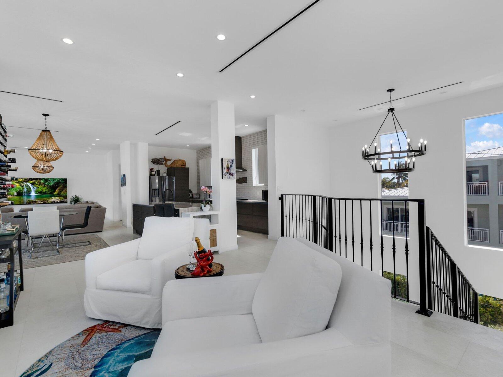 317 East Seaview Circle Marathon, FL 33050 - Photo 36 of 52 a living room with furniture a chandelier and a chandelier