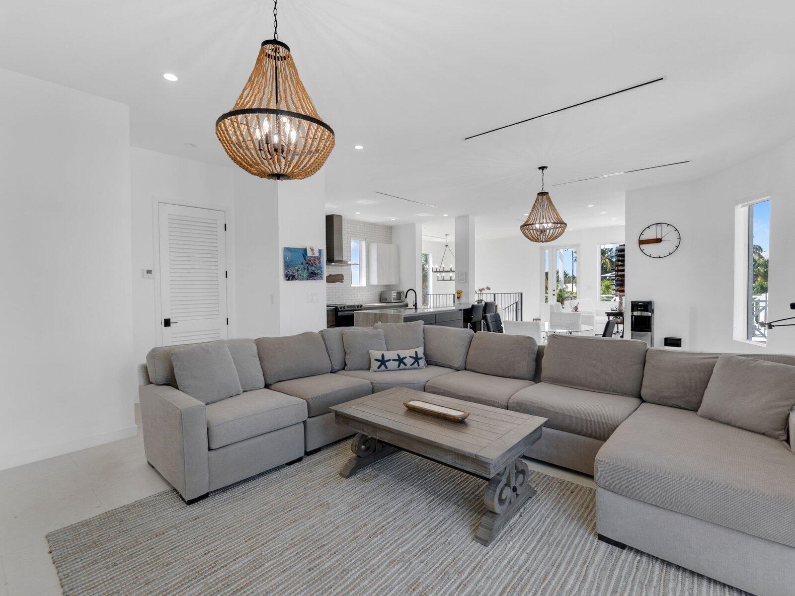 317 East Seaview Circle Marathon, FL 33050 - Photo 37 of 52 a living room with furniture a rug and white walls