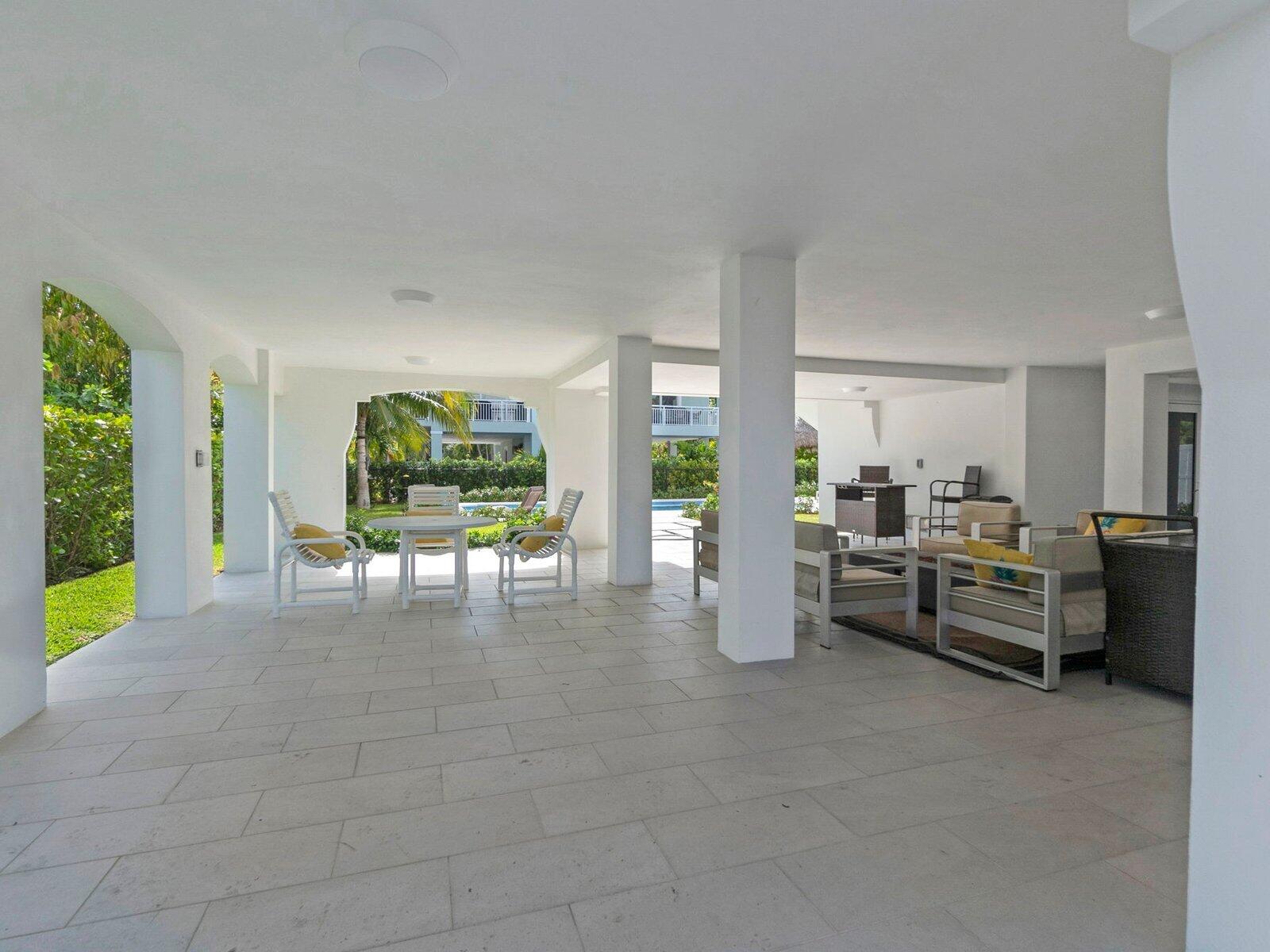 317 East Seaview Circle Marathon, FL 33050 - Photo 48 of 52 a dining room with furniture and a floor to ceiling window