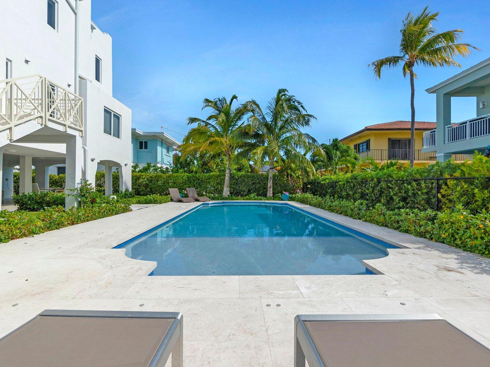 317 East Seaview Circle Marathon, FL 33050 - Photo 50 of 52 a swimming pool with outdoor seating and yard