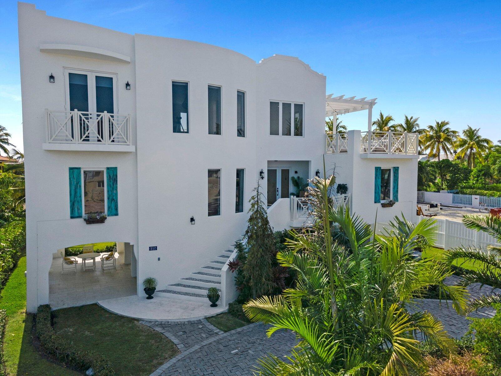 317 East Seaview Circle Marathon, FL 33050 - Photo 9 of 52 a front view of a house with a garden
