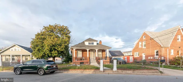 a car parked in front of a house