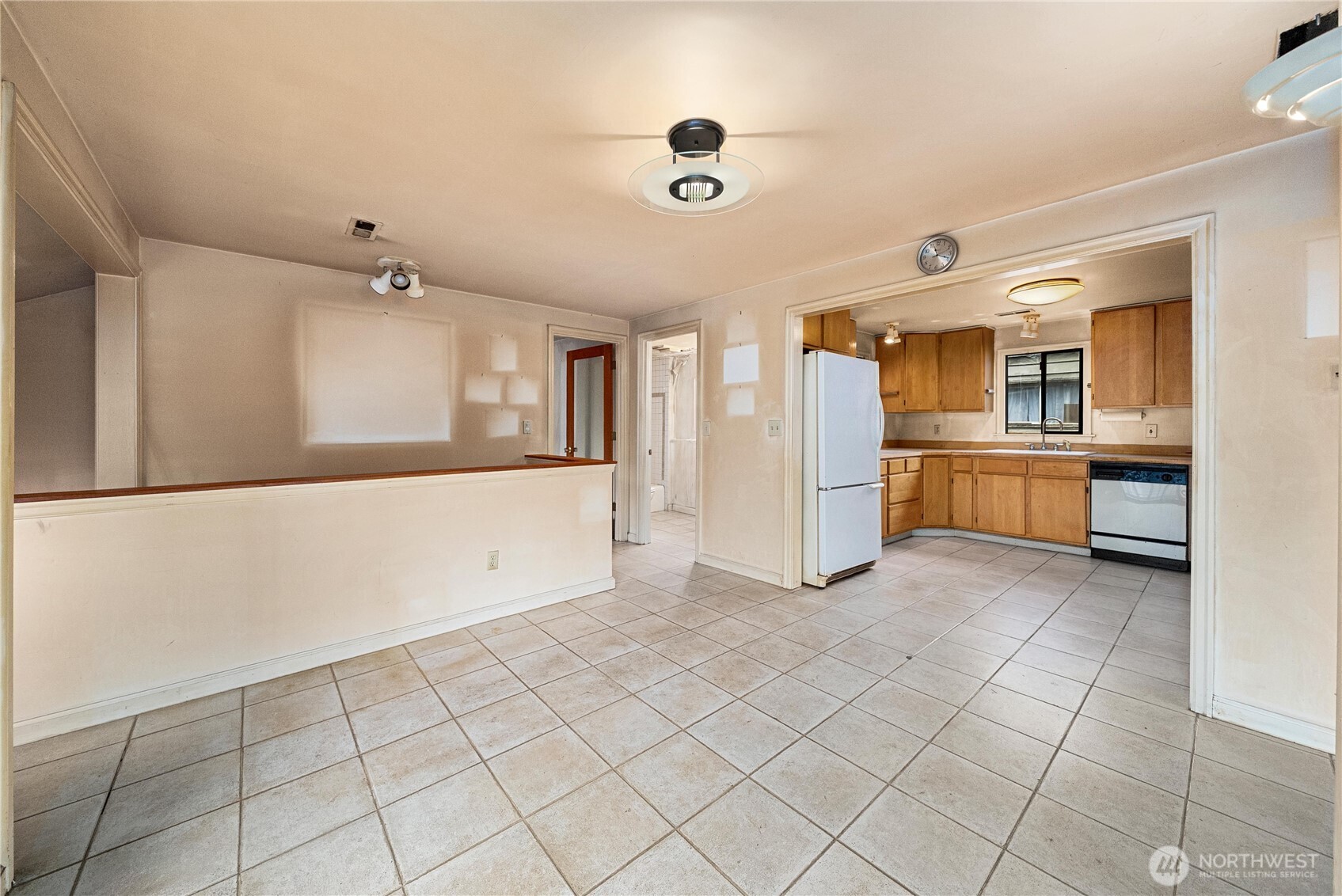 1230 South Donovan Street Seattle, WA 98108 - Photo 11 of 34 a view of a kitchen with dishwasher and white cabinets