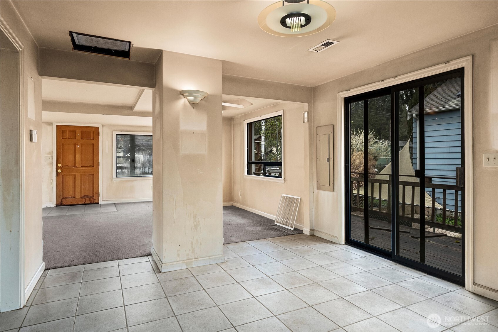1230 South Donovan Street Seattle, WA 98108 - Photo 17 of 34 a view of a hallway with wooden floor and windows