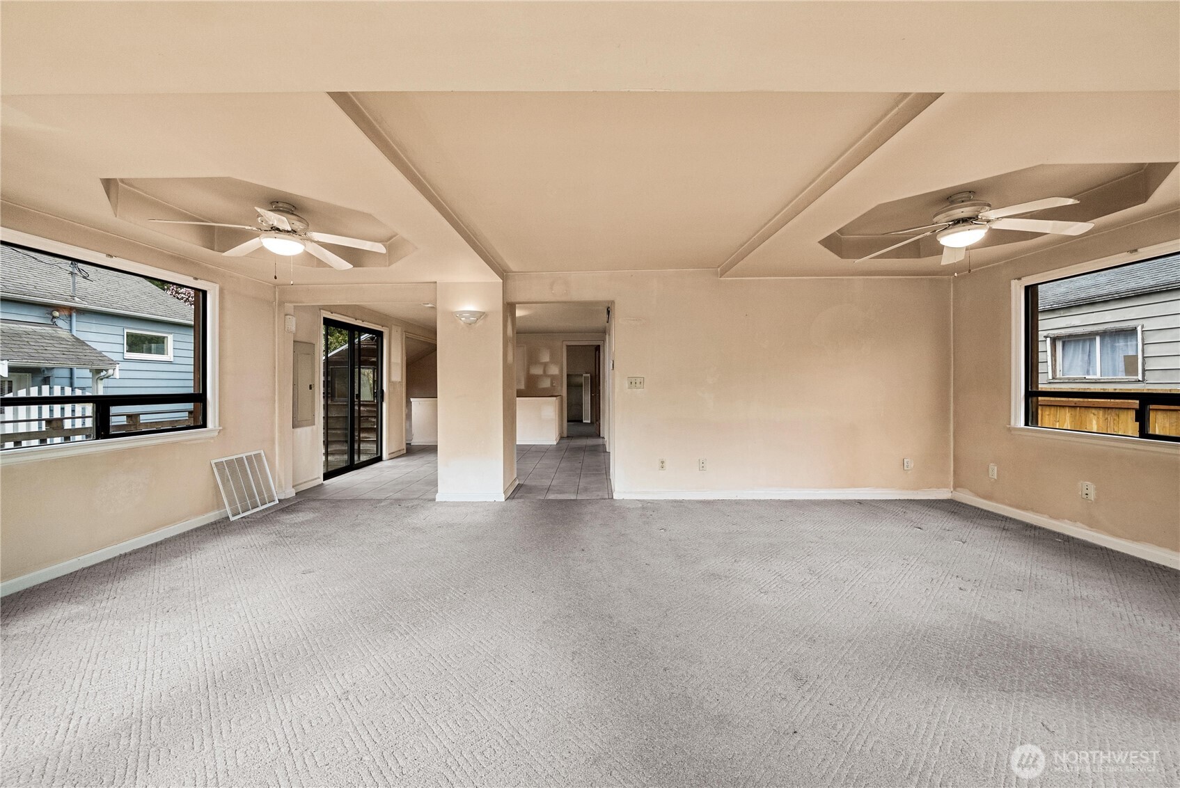 1230 South Donovan Street Seattle, WA 98108 - Photo 9 of 34 a view of a big room with windows and chandelier