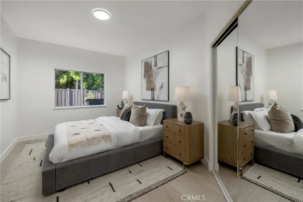 a bedroom with bed and window