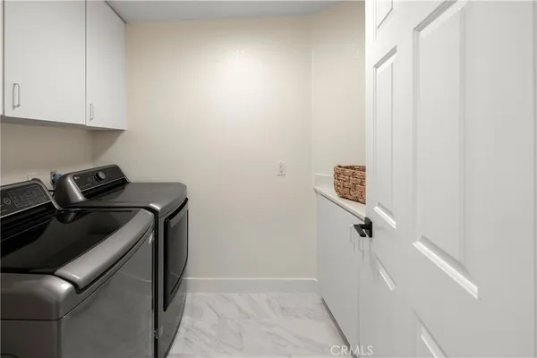 a view of a storage and utility room with closet