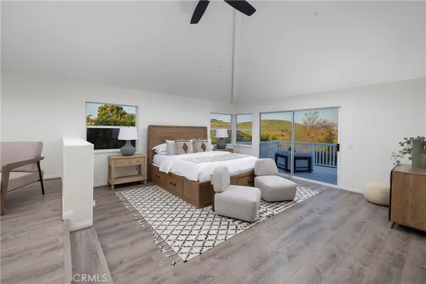 a bedroom with furniture and a fireplace