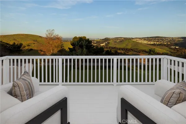 a bathroom with a tub a double vanity sink and mirror