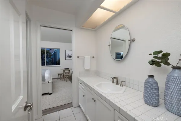 a bedroom with a bed and a chair