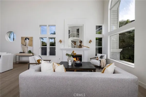 a bedroom with furniture and a large window