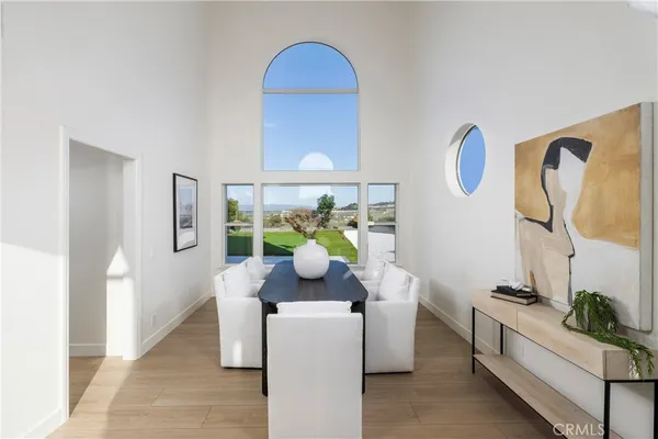 a living room with furniture flowerpot and window