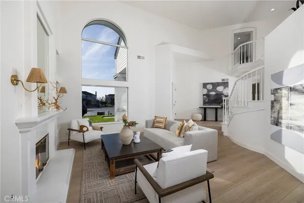 a living room with furniture fireplace and flat screen tv